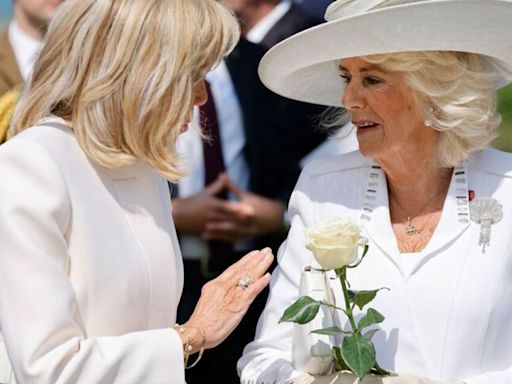 Brigitte Macron red-faced as she tries to hold Camilla's hand at D-Day memorial