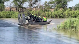 Search for 19-year-old in Arkansas River suspended due to weather