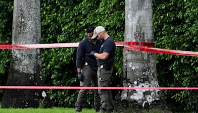 As Trump finished the fifth hole, just 300 yards away an AK-47 was poking through the bushes waiting for him