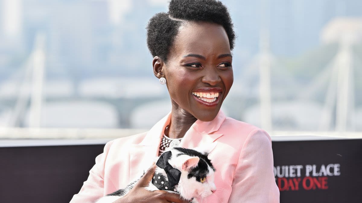 Why Did Lupita Nyong’o Accessorize Her Bubblegum Suit With a Live Cat?