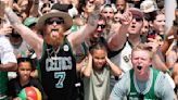 Boston Celtics fans line the streets to celebrate NBA title