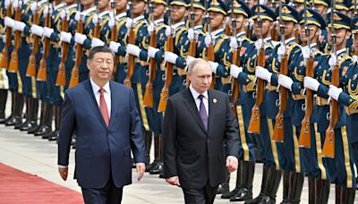 Xi lauds China-Russia ties as Putin lands in Beijing