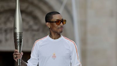 Paris 2024 Olympics: Happy Pharrell Williams brings style to torch relay