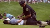 Climate protesters run onto 18th green and spray powder, delaying finish of PGA Tour event