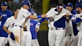 Rangers open title defense with walk-off win vs. Cubs in 10th