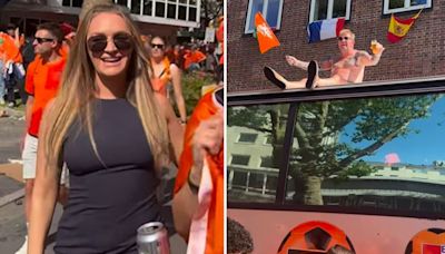 Laura Woods photobombed by 'naked' man on bus as she hangs out with Holland fans