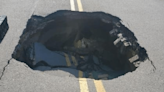 Photos: Sinkhole collapses busy road in Akron