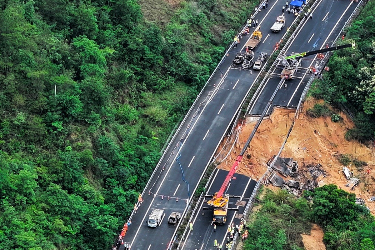 Highway collapse in China kills at least 48 people as cars sent crashing down into pit