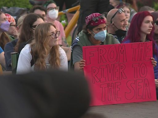 Large group of anti-war protestors gather at Saint Louis University
