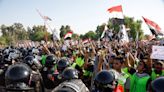 Tear gas fired, scores wounded in Baghdad protest marking 2019 unrest