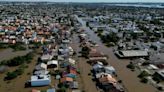 Brazilians queue for precious water as flood damage intensifies