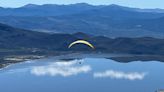 Watch as four paragliders launch off of Slide Mountain and soar over the Washoe Valley