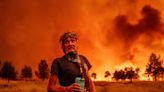 California blaze multiplies in size, forces thousands to evacuate