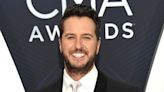 Luke Bryan brushes off onstage fall after slipping on fan's phone: 'My lawyer will be calling'