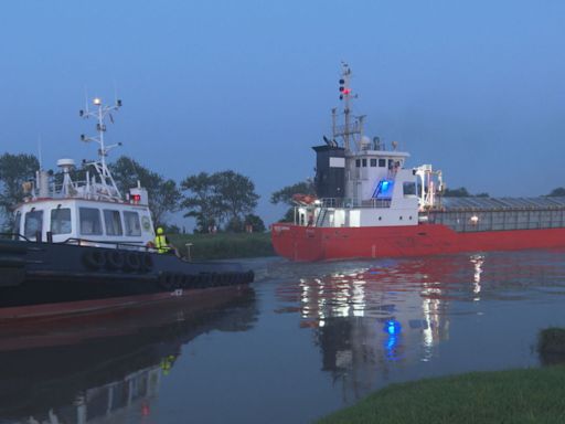 Wedged ship is towed to safety after tugs pull it free | ITV News