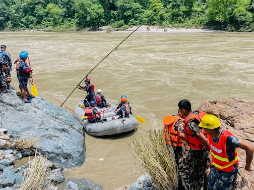 Rescuers in Nepal resume search for 66 still missing after landslide sweeps buses into river