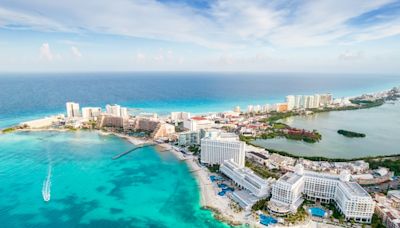 Gunmen on a jet ski open fire at a beach in Cancun, killing a 12-year-old boy