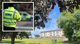 Police cordon off village green behind church