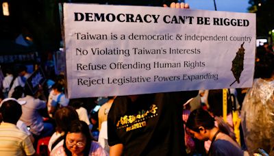 Tens of thousands protest against contested Taiwan parliament reforms