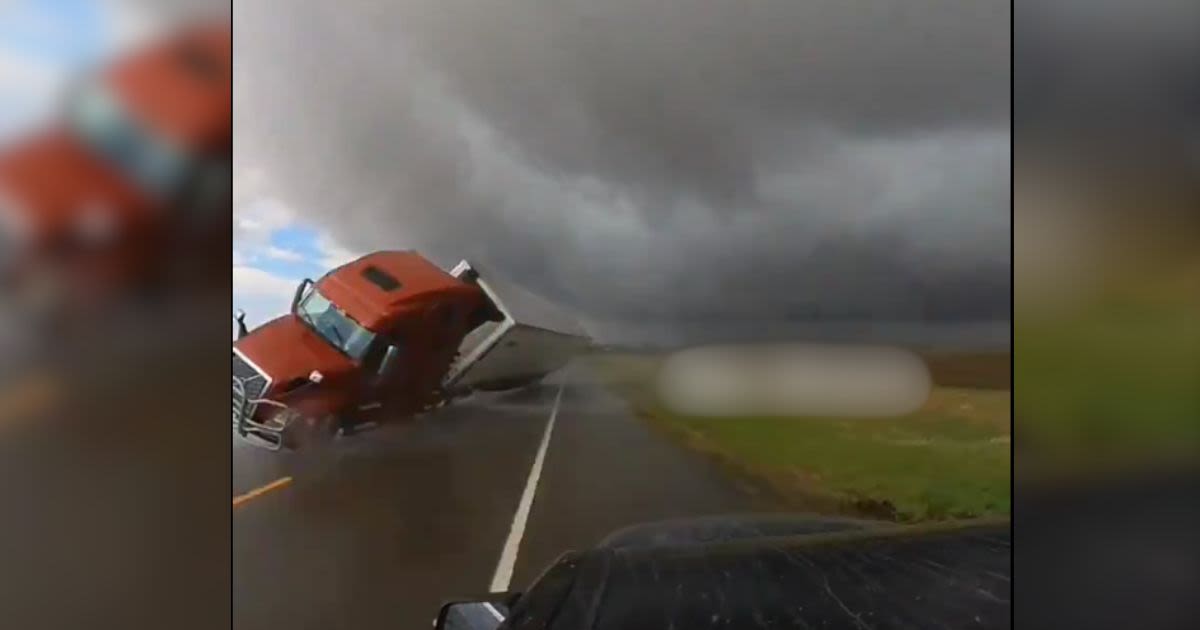 Watch Storm Chaser’s Run Get Cut Short After Wind Throws a Semi Truck Into His Path