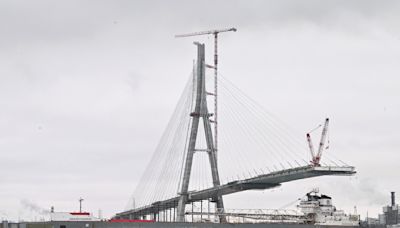 Workers link US, Canadian sides of new Gordie Howe International Bridge over Detroit River