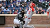 Cardinals go up early, hold off Mets