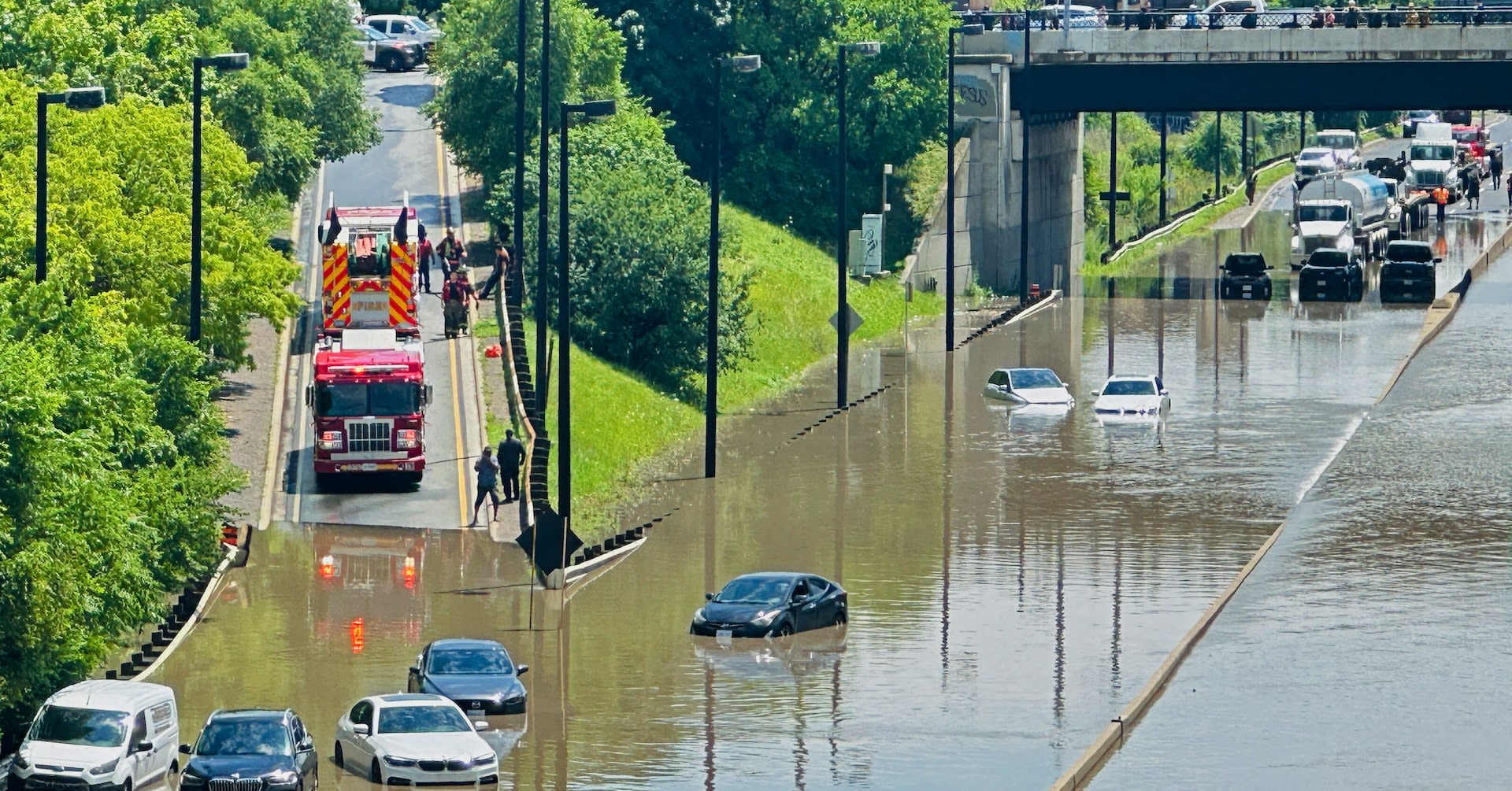 Torrential rains flood Toronto, causing power outages, traffic disruption