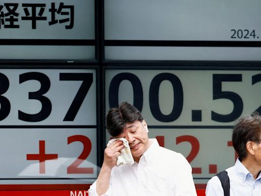 Japan stocks jump in record daily gain after slump