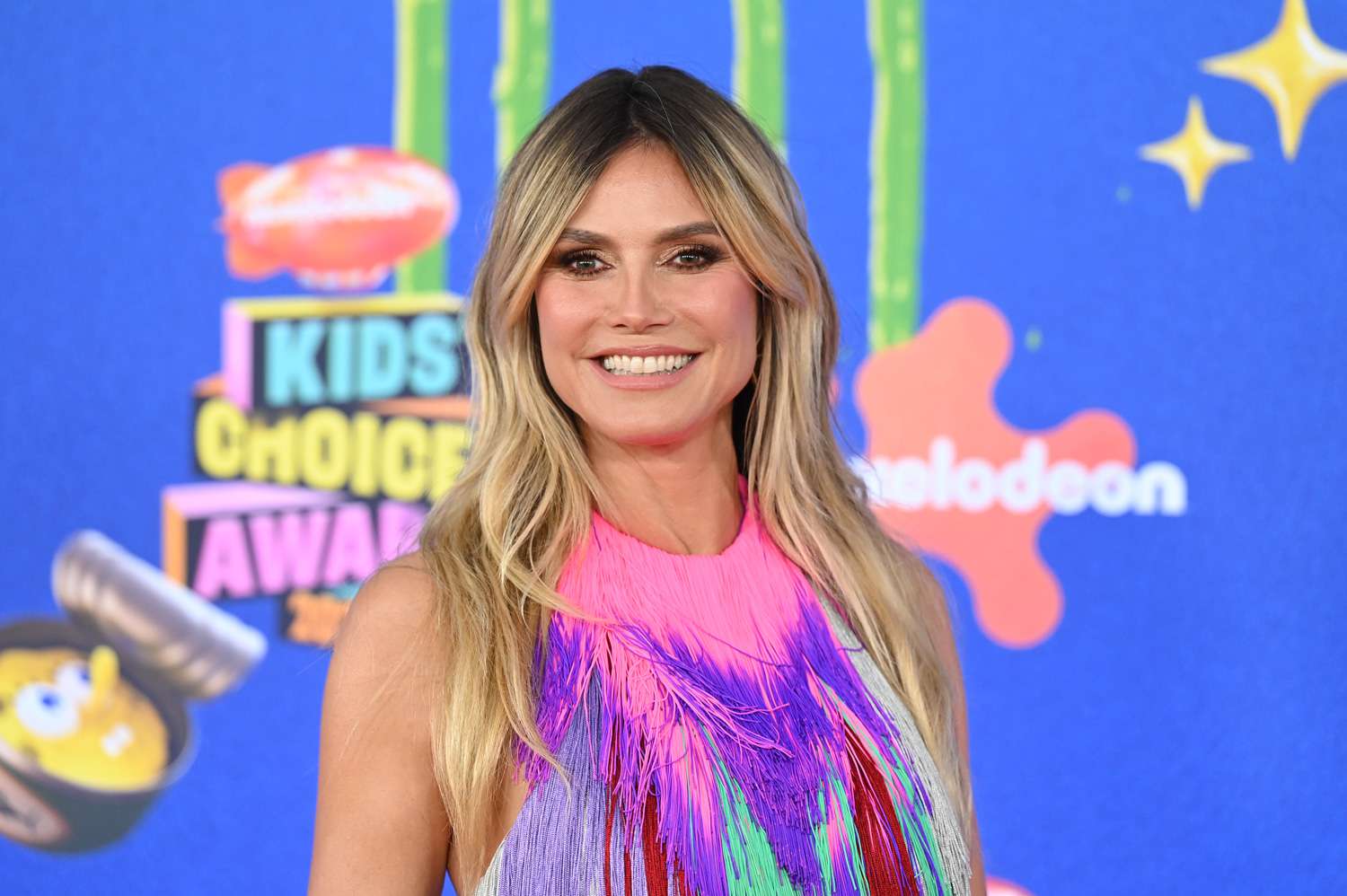 Heidi Klum Rocks Multi-Color Neon Tassel Dress and Pink Nails at 2024 Kids' Choice Awards