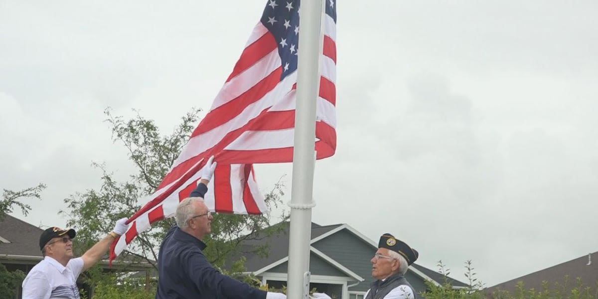 Watertown neighbors raise their new flag on Independence Day