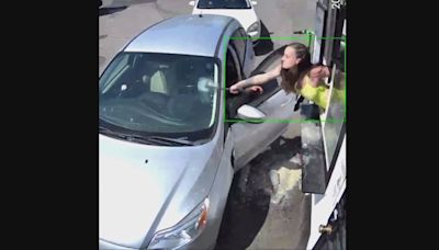 Seattle bikini barista shatters windshield with hammer after customer throws drinks at her