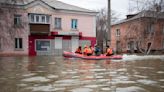 Russians stage a rare protest after a dam bursts and homes flood near the Kazakh border