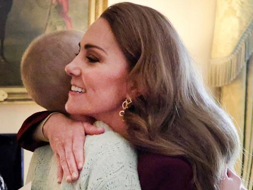 Princess Kate Returns To Work In Burgundy And Embraces Young Photographer Battling Cancer