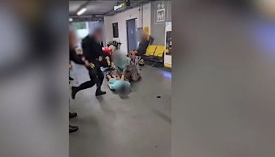 GMP officer 'removed from operational duties' after video showed man being kicked in head at Manchester Airport