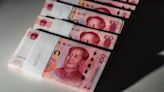 China's Loosening Grip on Yuan Allows Currency to Test a Key Milestone