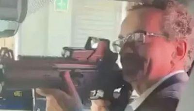 Moment British ambassador to Mexico points an assault rifle at staff member