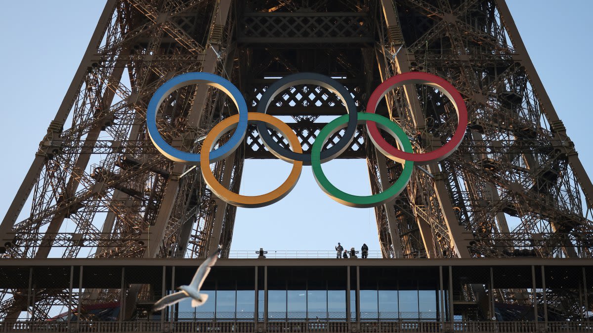Olympic rings mounted on the Eiffel Tower 50 days ahead of the Summer Games