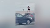 Fleeing driver stops SUV, strips naked on L.A. freeway