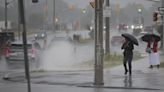 Heavy rain falling in Toronto and the GTA, some flooding on Lakeshore Boulevard near Ontario Place