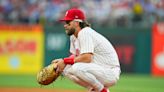 Harper out of Phillies' lineup with bruised hand, Wheeler iffy for Sunday