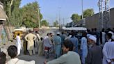 Pakistan summons Afghan diplomat to protest a suicide attack that killed 8 soldiers in the northwest