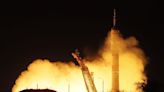 Soyuz spacecraft carrying 2 Russians, American docks with space station
