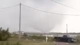 Waterspout-turned-tornado seen on video tearing roof off home