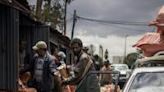 People clear out street stalls before a planned demolition in the historic Piassa neighbourhood of Addis Ababa