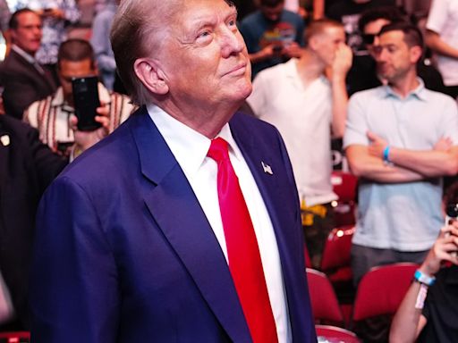 Donald Trump receives standing ovation as he arrives at UFC 302 with Dana White
