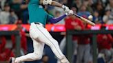 J.P. Crawford of the Seattle Mariners hits a grand slam during the fourth inning against the Los Angeles Angels at T-Mobile Park on Saturday, June 1, 2024, in Seattle.