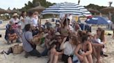 Mallorca locals cram together under one parasol in latest overtourism protest