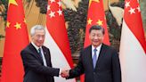 China and Singapore must boost coordination as 'stabilising forces', Wang Yi says