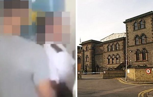 Woman charged after viral video 'showing prison officer having sex with inmate'