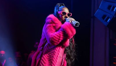 Ashanti Radiates Joy as She Debuts Baby Bump On Stage